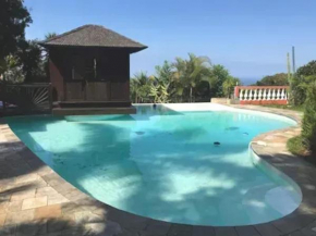 Bungalow charmant avec jardin à Saint-Louis, piscine partagée